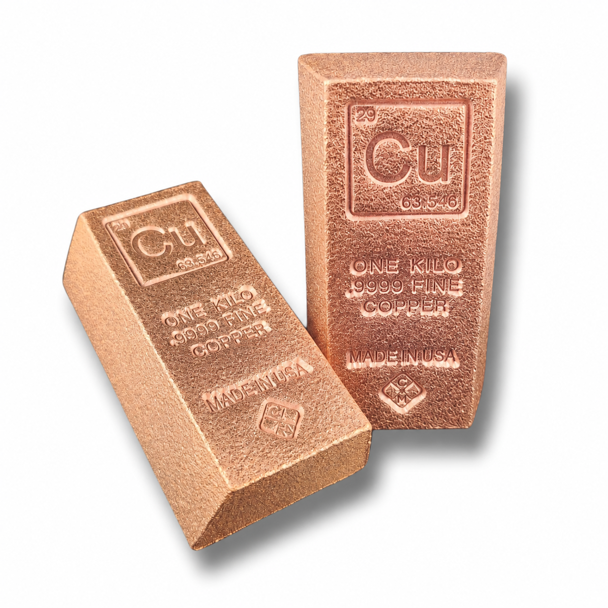 Two copper bars shown on a white background, one upright and one leaning, both embossed with 'Cu', 'ONE KILO 9999 FINE COPPER', and 'MADE IN USA'.